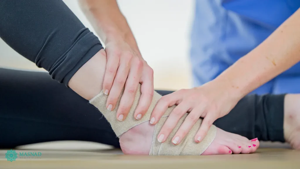 Physiotherapist treating ankle