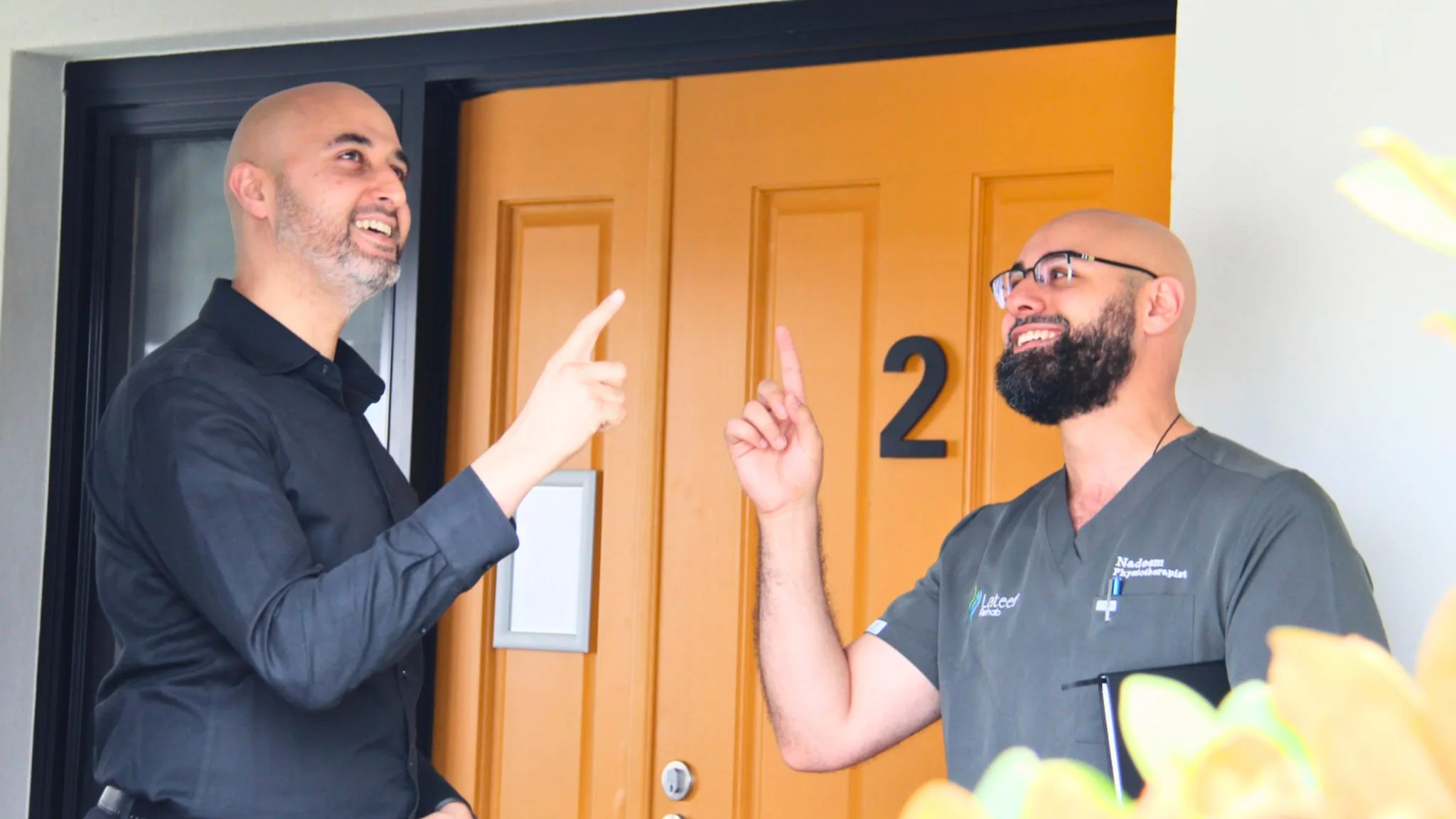 aman-aged-care-staff-pointing-doorway