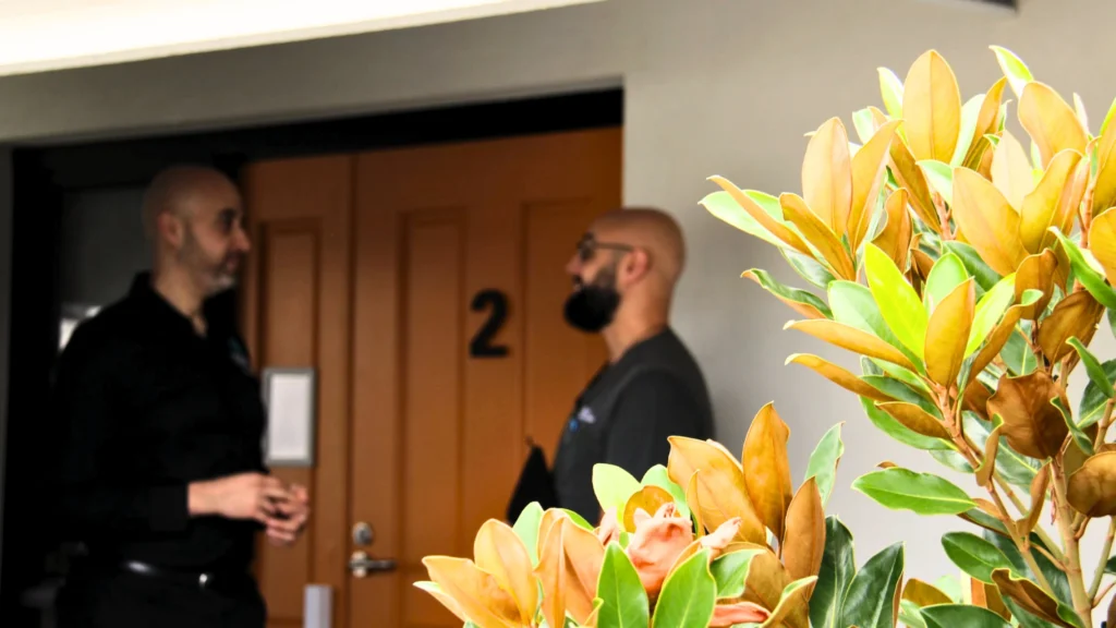 aman-aged-care-staff-resident-doorway