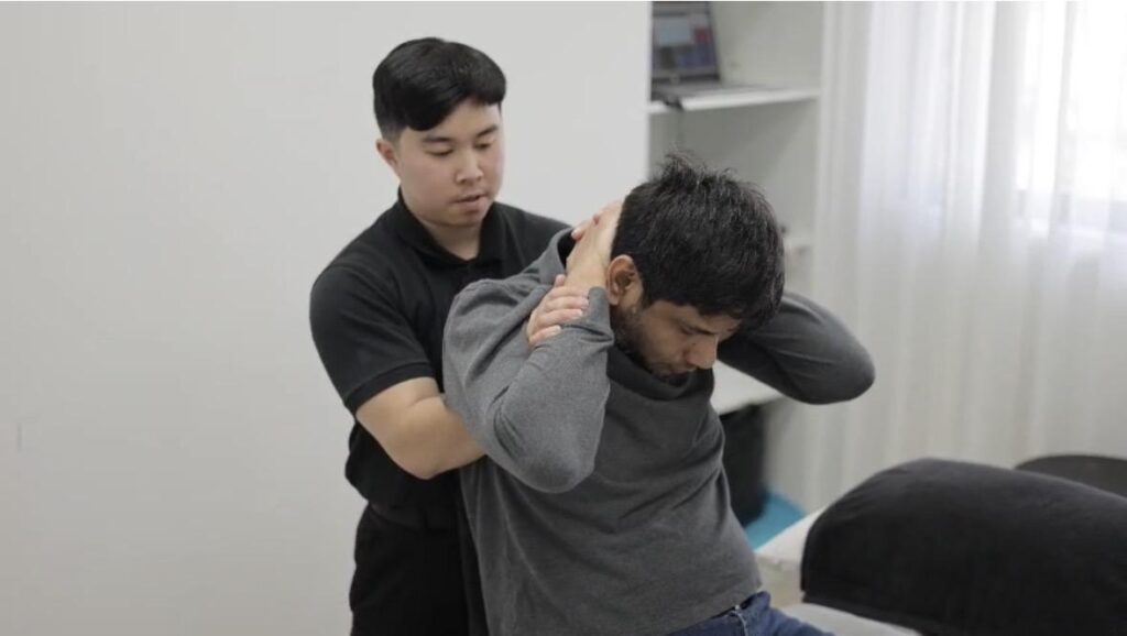 Chiropractor discussing treatment options and safety with a patient