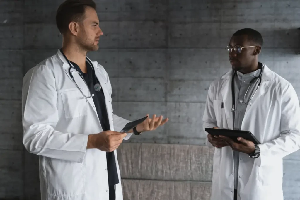 Patient receiving education about chiropractic treatment.