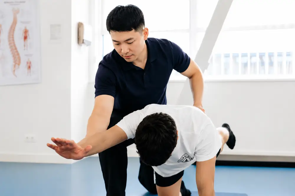Patient performing exercises for lower back and leg symptoms.