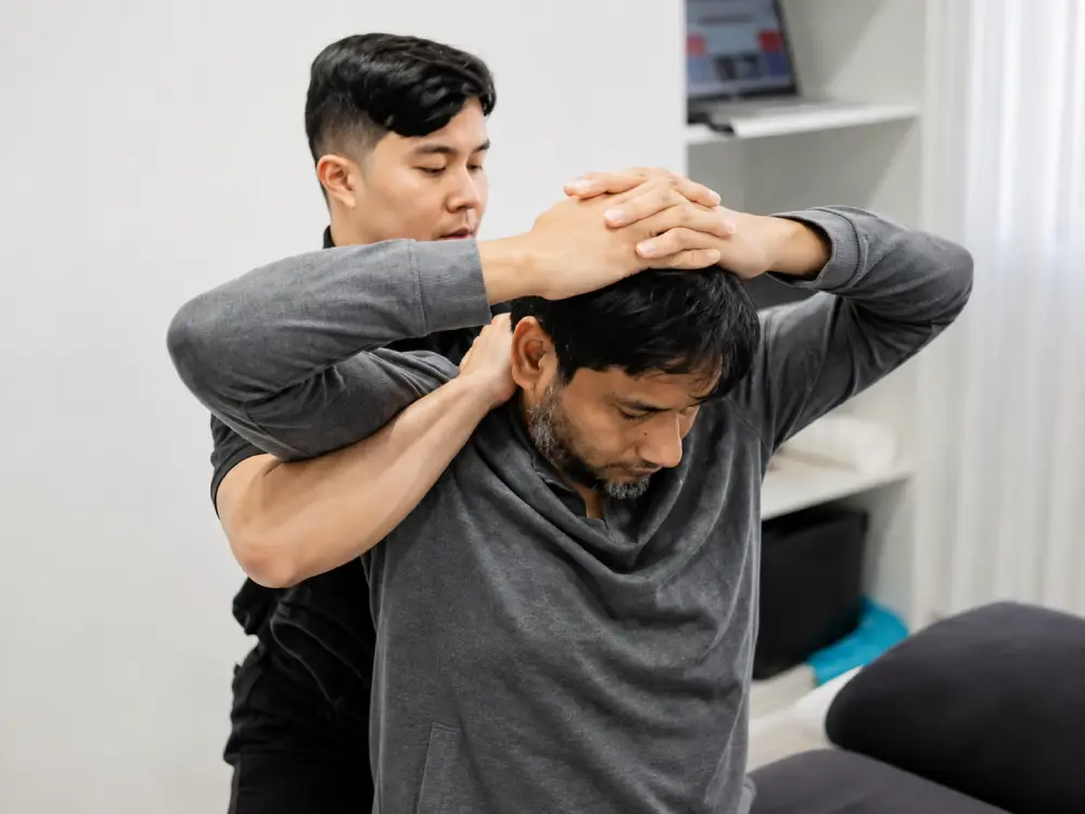 Chiropractor discussing a personalised treatment plan with a patient.