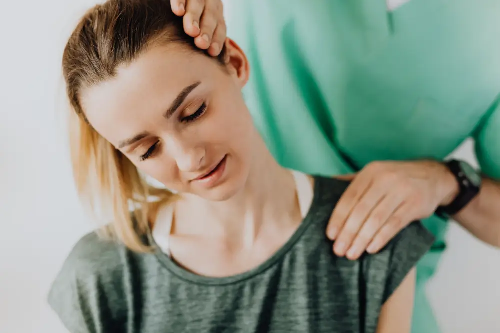 Person experiencing shoulder pain during movement.