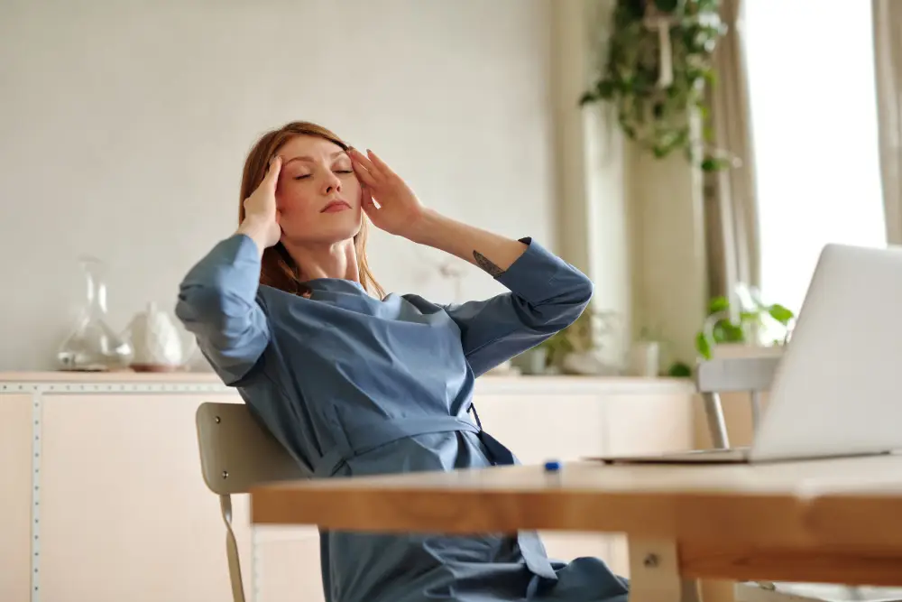 Person experiencing headache and neck discomfort.